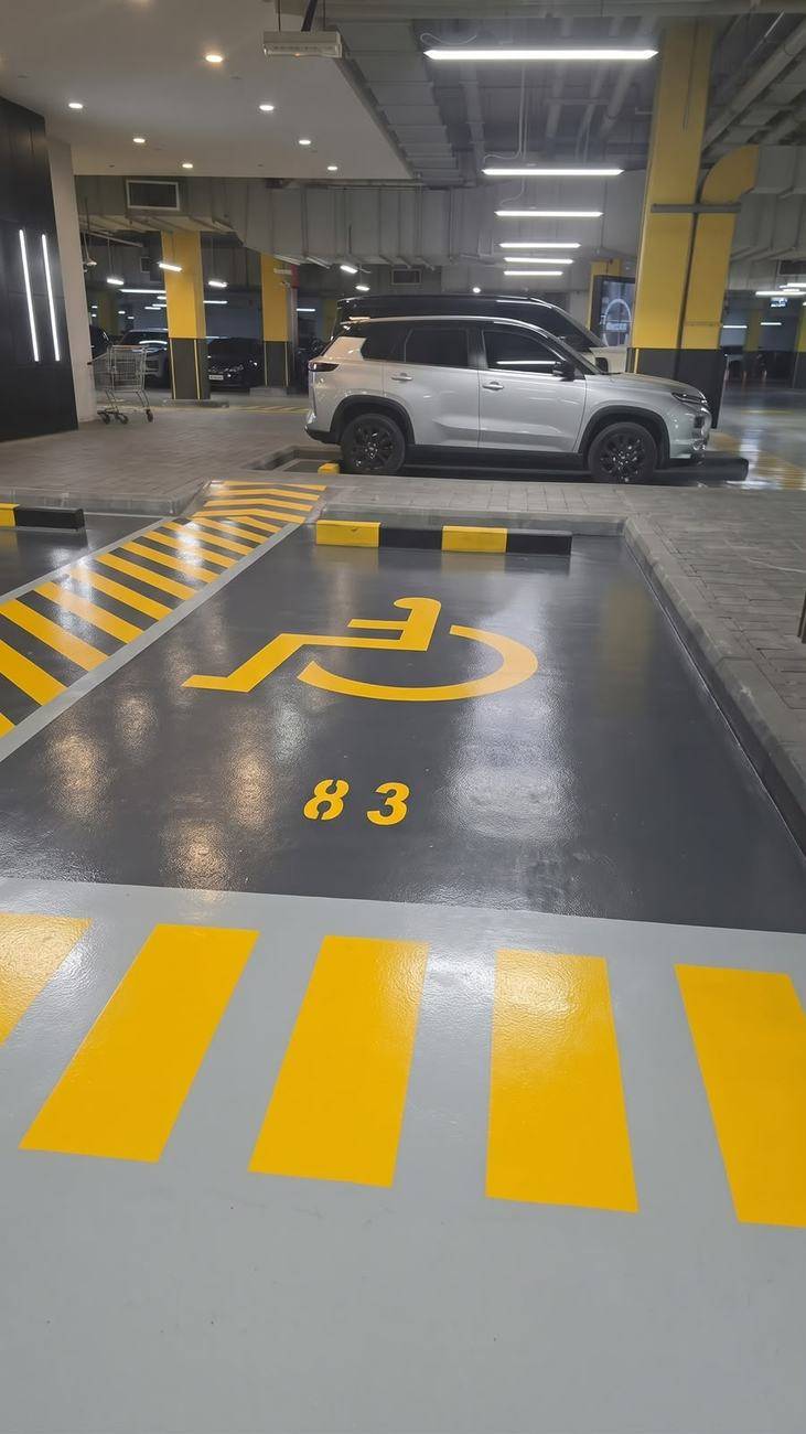 Car park epoxy flooring — accessible bay and crossing — 06 Mall, Sharjah
