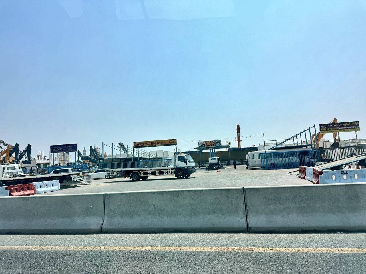 Commercial yard — workshop units and truck parking — Industrial Area 12, Al Senaiyat