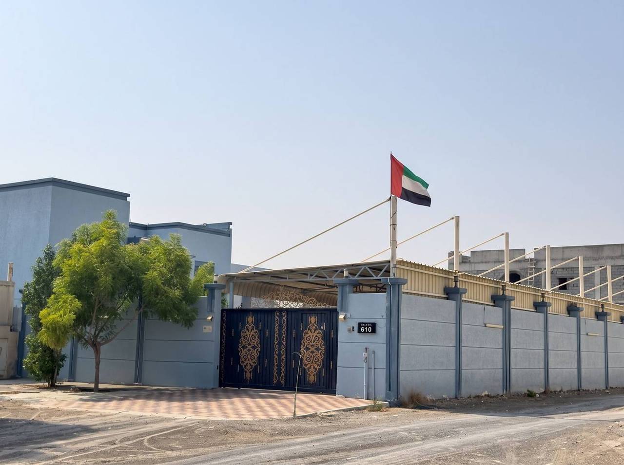 Walled compound — ornamental gate, canopy and services block — Al Rahmaniya, Sharjah